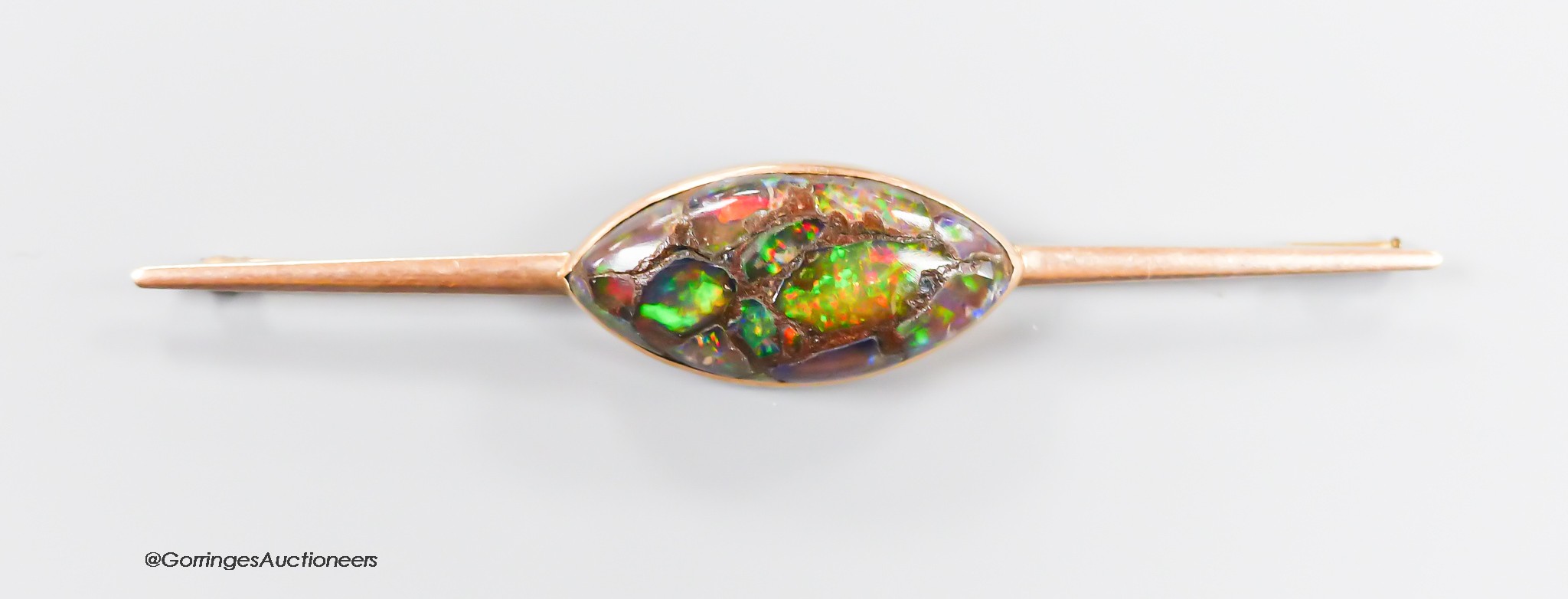 A yellow metal and navette shape opal doublet? set bar brooch, 86mm, gross weight 10.3 grams.